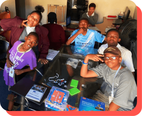 Learning Lab desks with laptops and stationery for learners